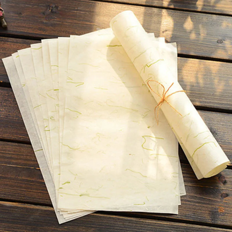Ten sheets of Chinese ancient-style painting paper in green, red, and yellow designs, measuring 27.5 by 16.7 cm