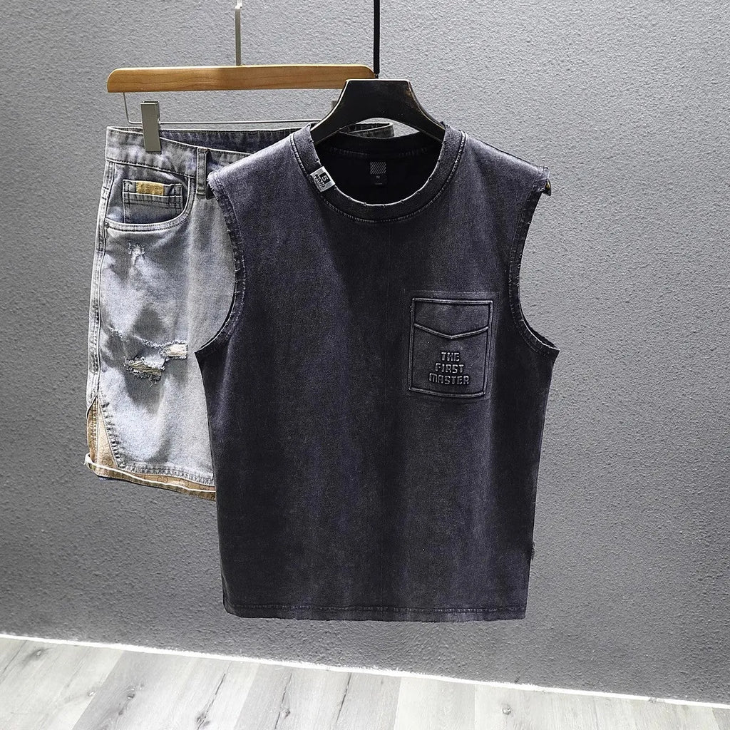 Solid colour loose fit cotton sleeveless t-shirt on a hanger, shown in black and white colour options.