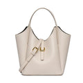Genuine leather women's retro bucket handbag in beige with sewn detailing and an outer pocket.