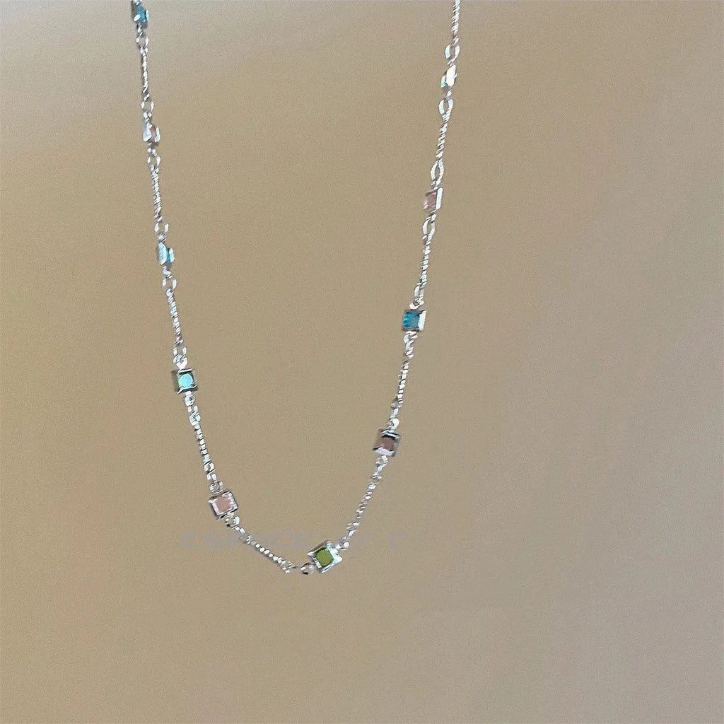 Square colour artificial crystal geometric pendant necklace on clavicle-length chain in gold tone