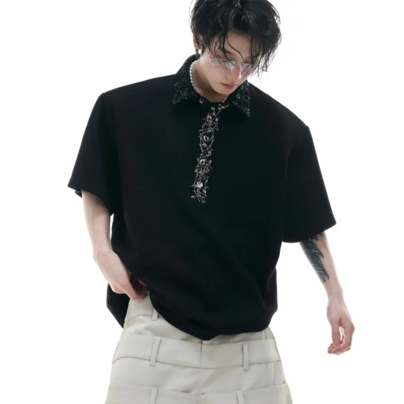 Men's black loose-fit polo shirt with embroidery sequins and square collar, short sleeves, on a hanger