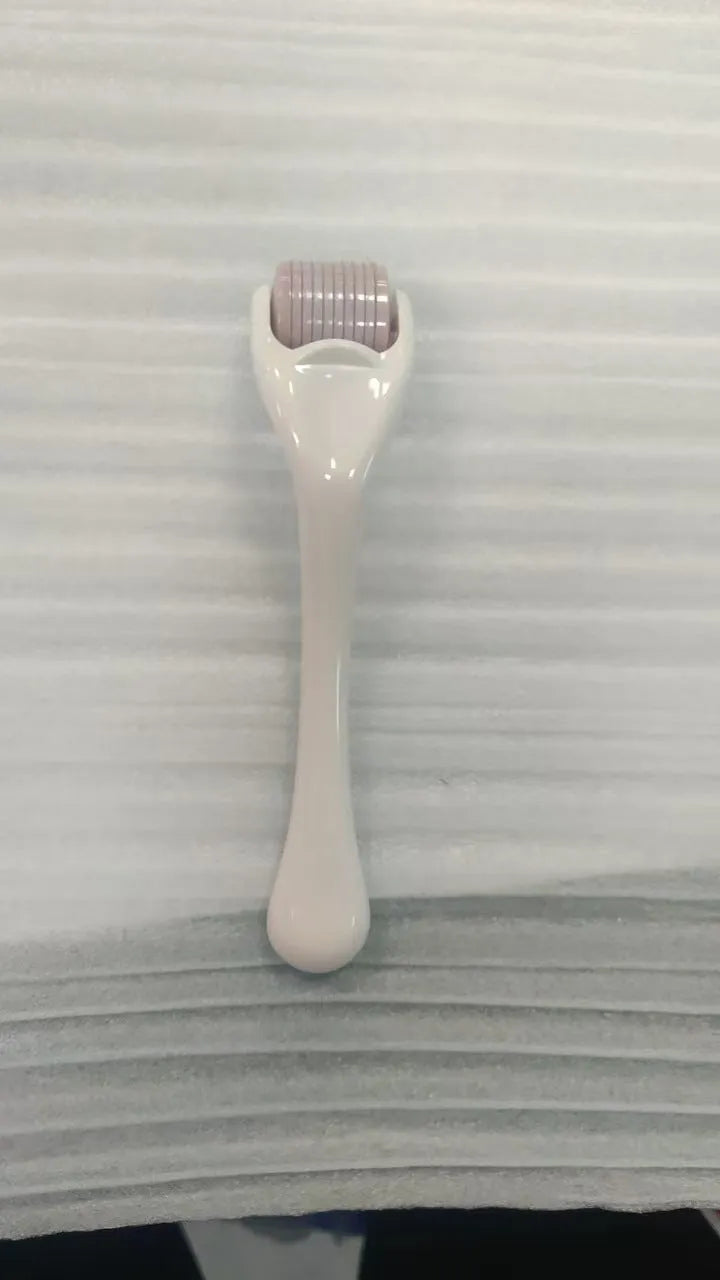 540 micro needle roller with PC handle and coloured wheel showing needle configuration for skin treatment