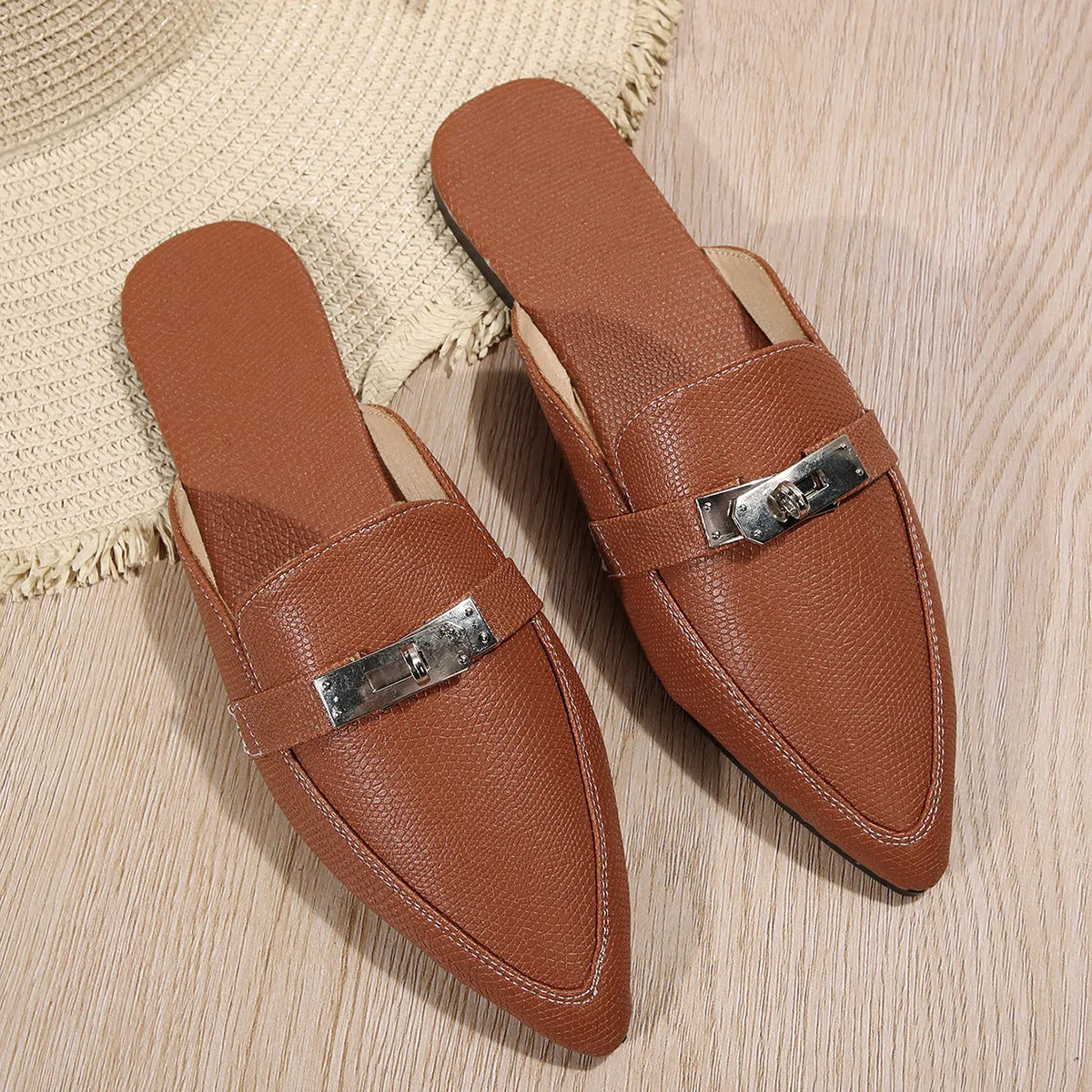 Light brown women's pointed-toe semi-slippers with a low heel and rubber sole.