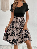 Women's khaki A-line dress with plant pattern printing and shoulder strap detail