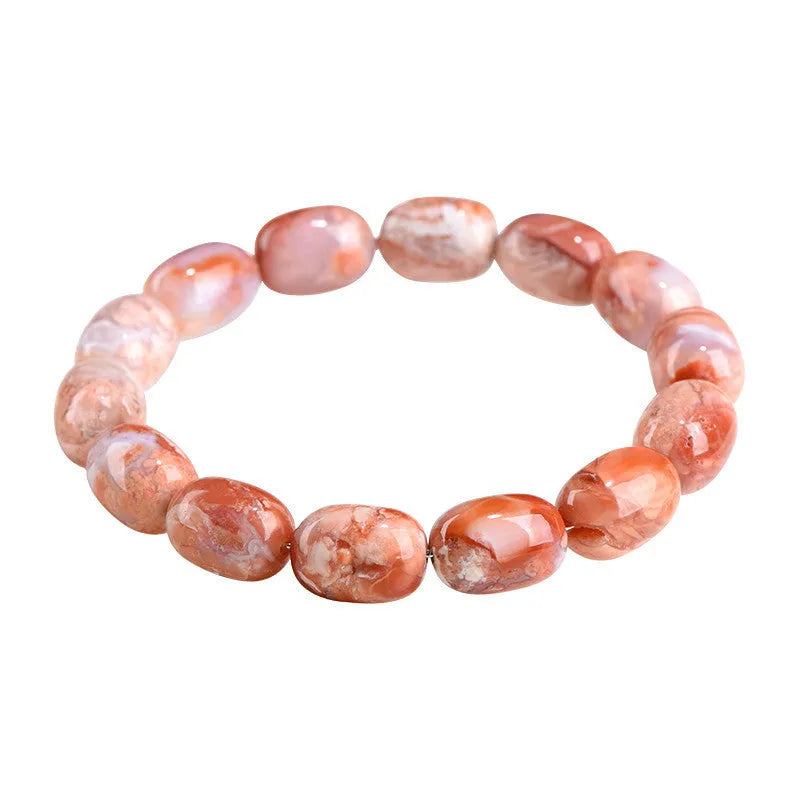 Natural cherry agate barrel shaped bead bracelet showing 10x14mm geometry design with Ruyi elements on wrist
