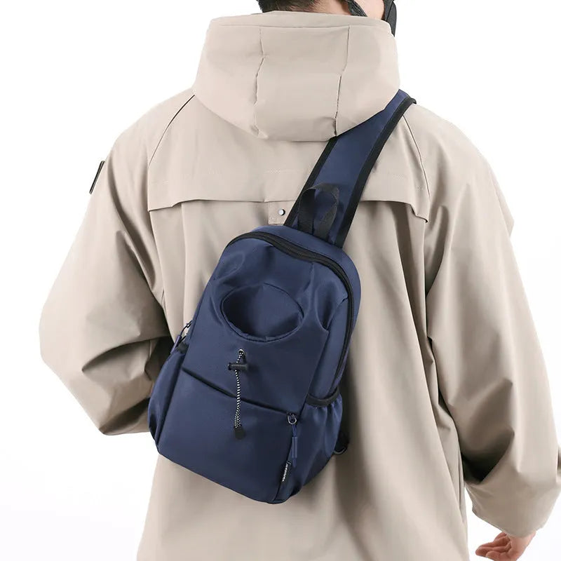 Dark grey Oxford cloth crossbody chest bag with stitching detail, shown being worn.