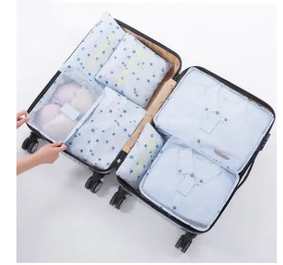 Set of six waterproof nylon packing cubes and organisers in assorted colours and sizes.