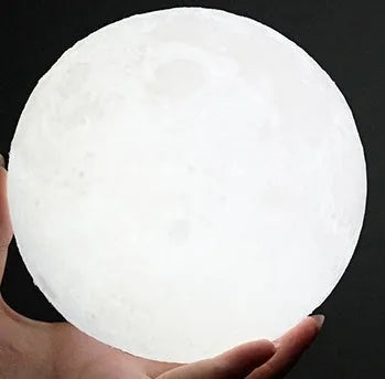 3D printed spherical moon lamp with visible surface contours and touch-sensitive metal ring at base