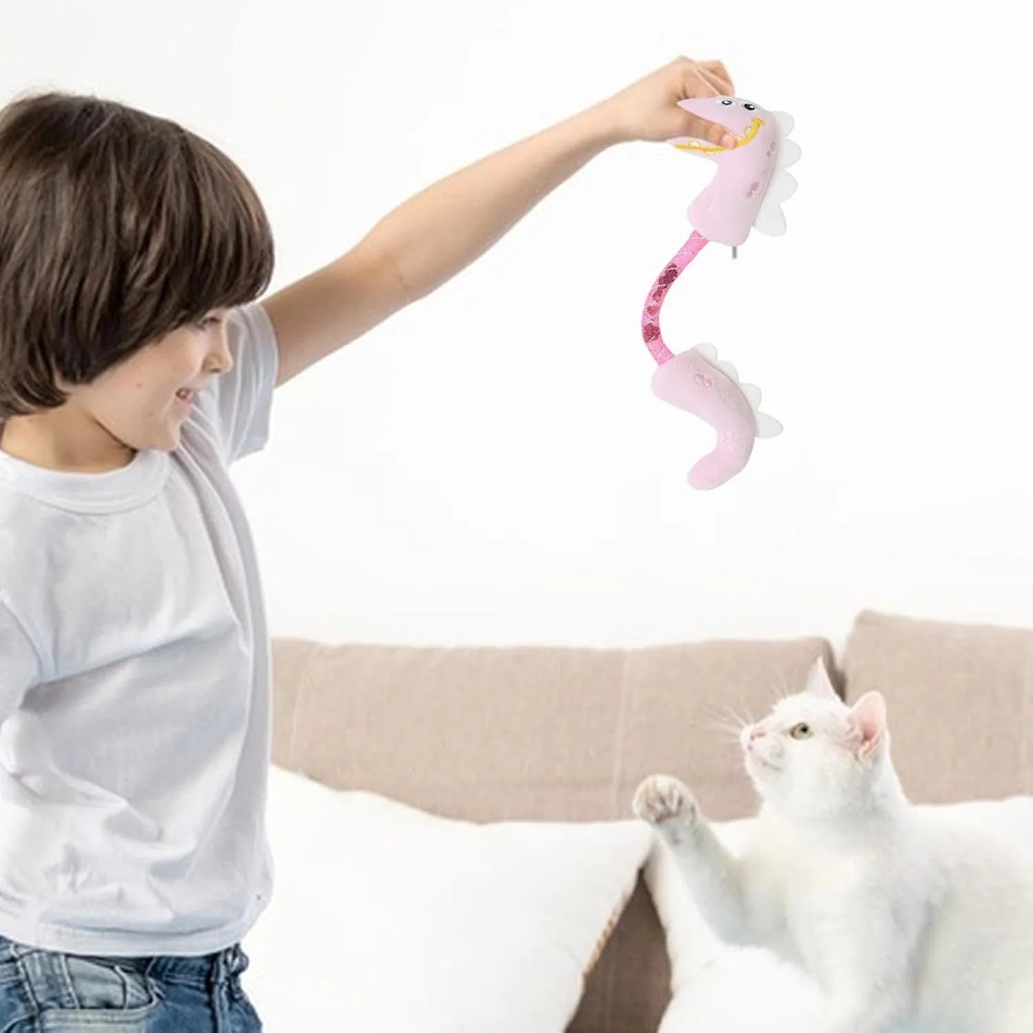 Four plush cat chew toys in pink, purple, and yellow colours showing mouse, fish, bunny, and catnip designs