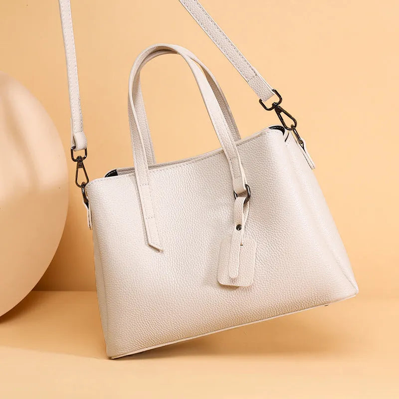 Women's cowhide leather shoulder handbag in horizontal square shape with contrast colour details and single strap