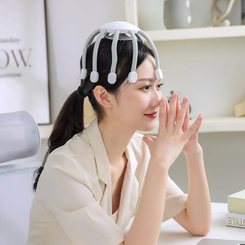 USB head massager with multiple vibrating claws in black or white colour options showing scalp placement
