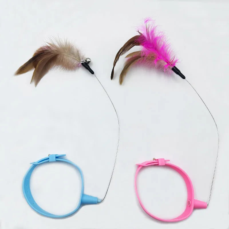 Adjustable steel wire cat collar toy with a blue plastic feather teaser and bell attached.