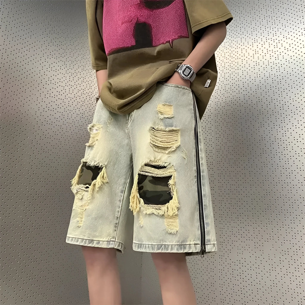 Men's yellow mud camouflage ripped denim shorts in a straight-leg style