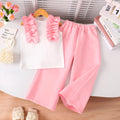 White cotton two-piece children's set with sleeveless bow top and pants, sizes 4Y to 7Y
