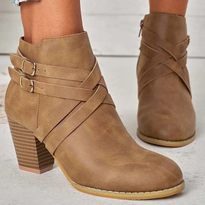 Short boots with 7cm heels in black, brown, or grey colours, showing side zipper and rubber sole