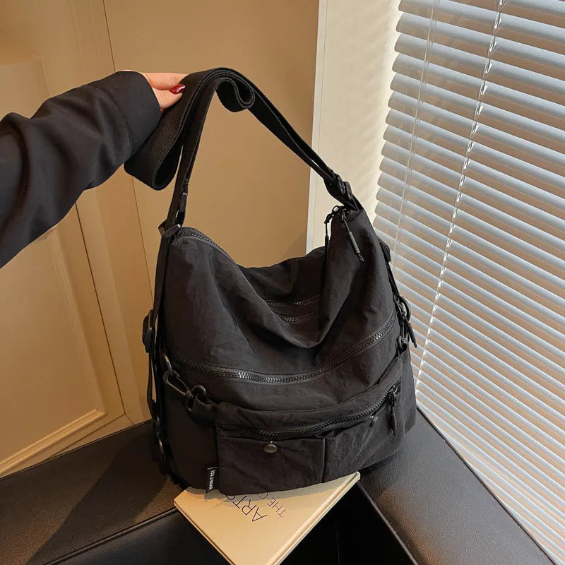 Women's soft nylon crossbody bag with sandwich zipper pocket and adjustable shoulder straps