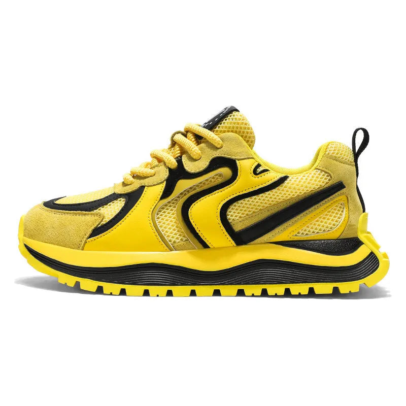 Men's round-toe sneakers in yellow with mesh panels and white laces on a rubber sole.
