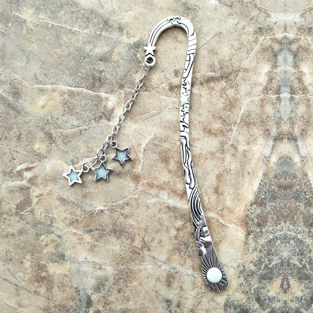 Retro five-pointed star metal bookmark with fluorescent finish and celestial motifs
