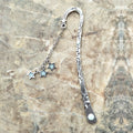 Retro five-pointed star metal bookmark with fluorescent finish and celestial motifs