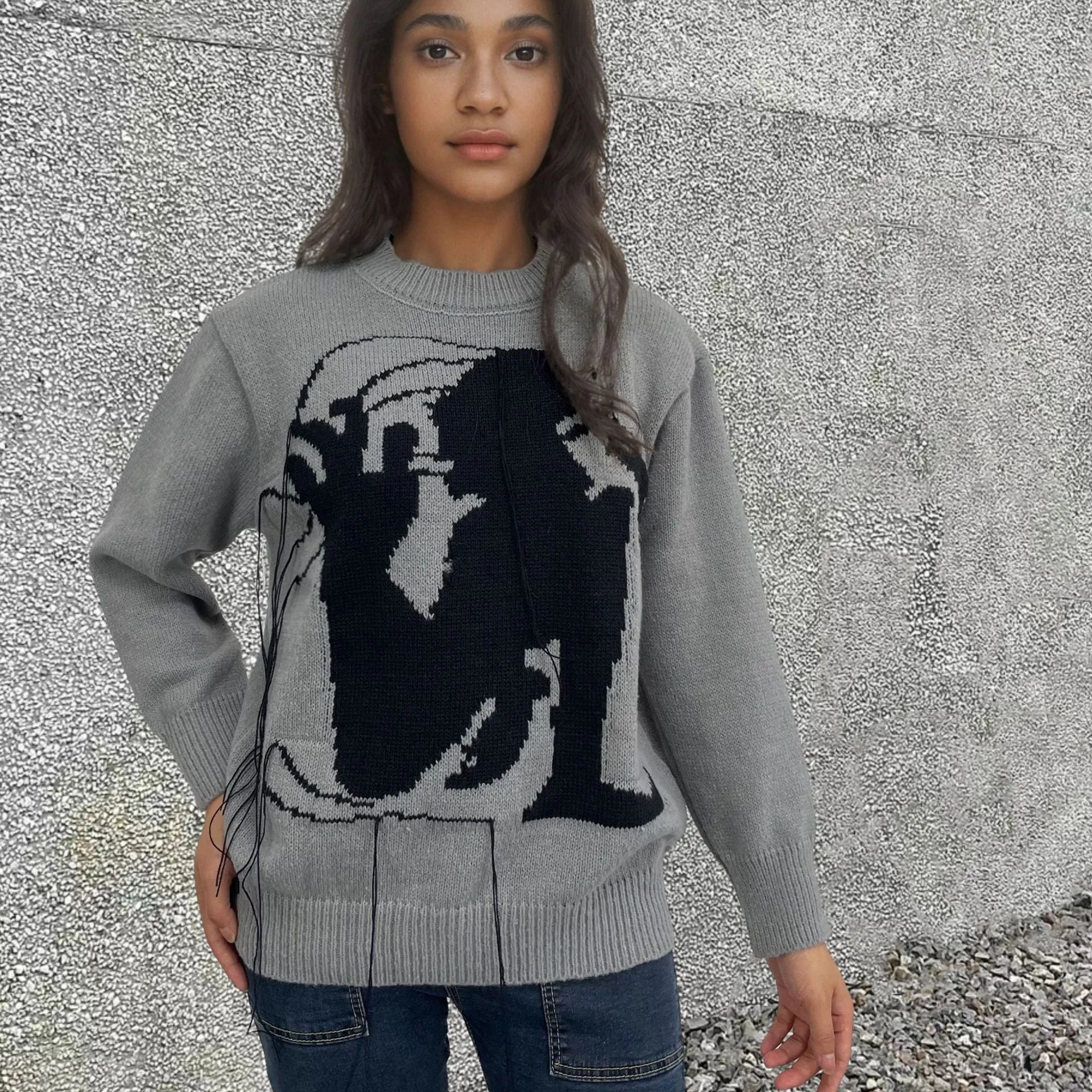 Grey women's alpaca wool pullover sweater with abstract pattern and tassel detail, loose street fashion fit.