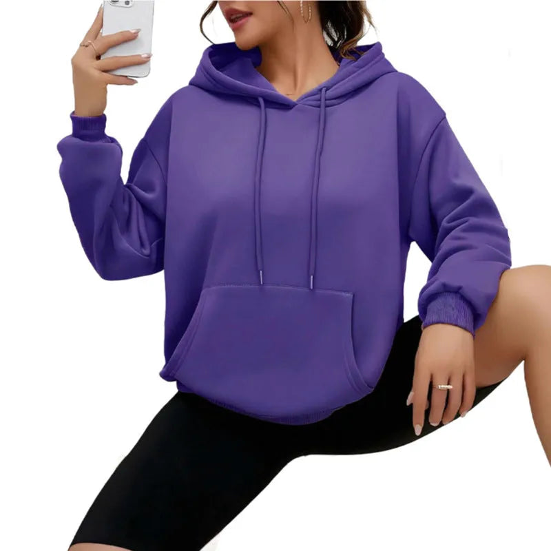 Women's loose grey sweatshirt with long sleeves and a front drawstring pocket, shown in a relaxed fit.