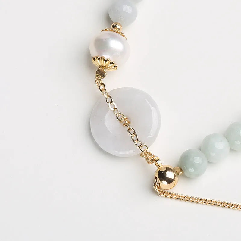 Handcrafted jade peace buckle bracelet with geometry design, round pendant, and national style elements