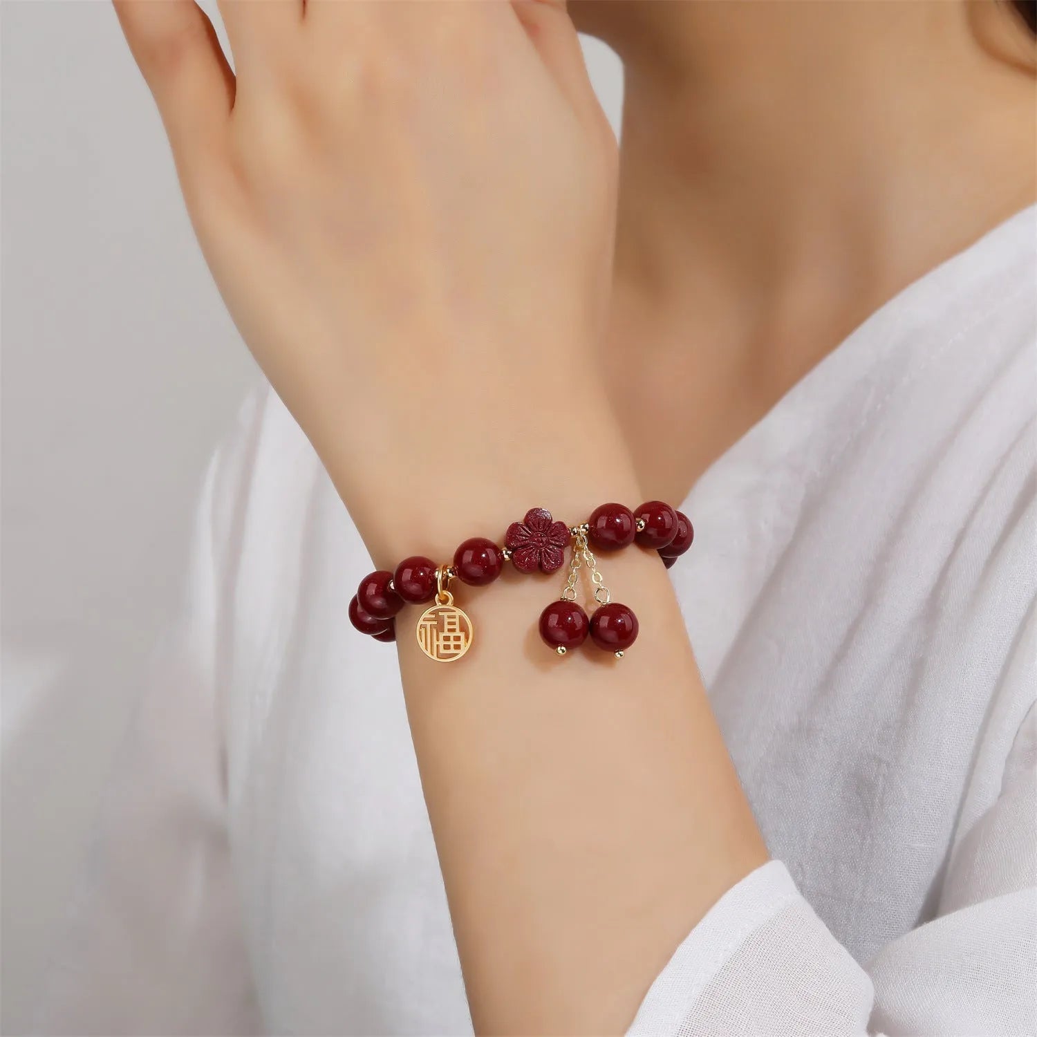 Women's purple gold sand cinnabar bracelet with fu character and peach blossom design on adjustable band