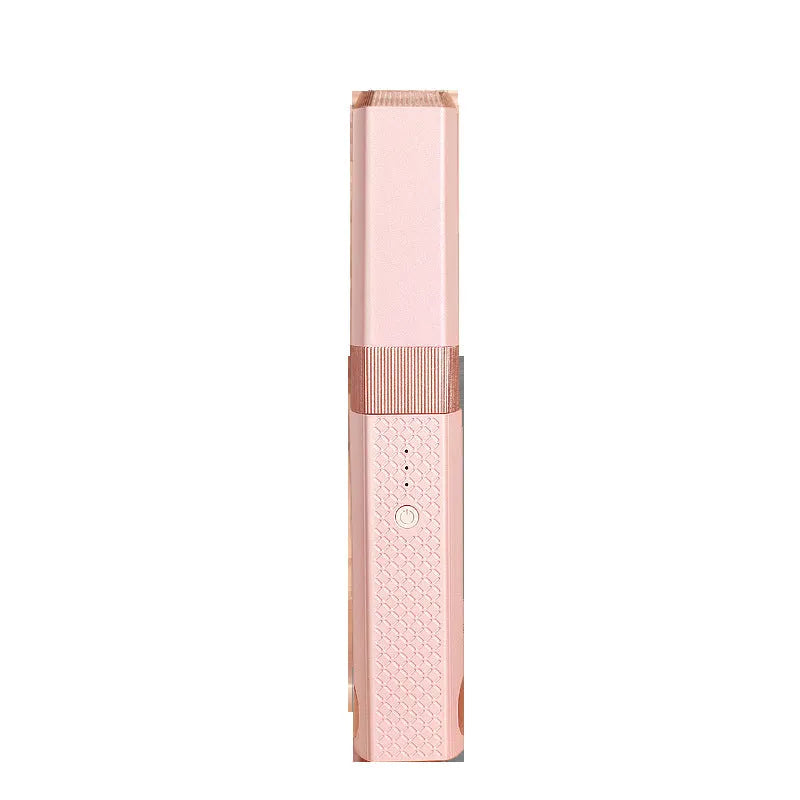 Pink and green cordless USB hair straightener with ceramic plates, shown with USB cable.
