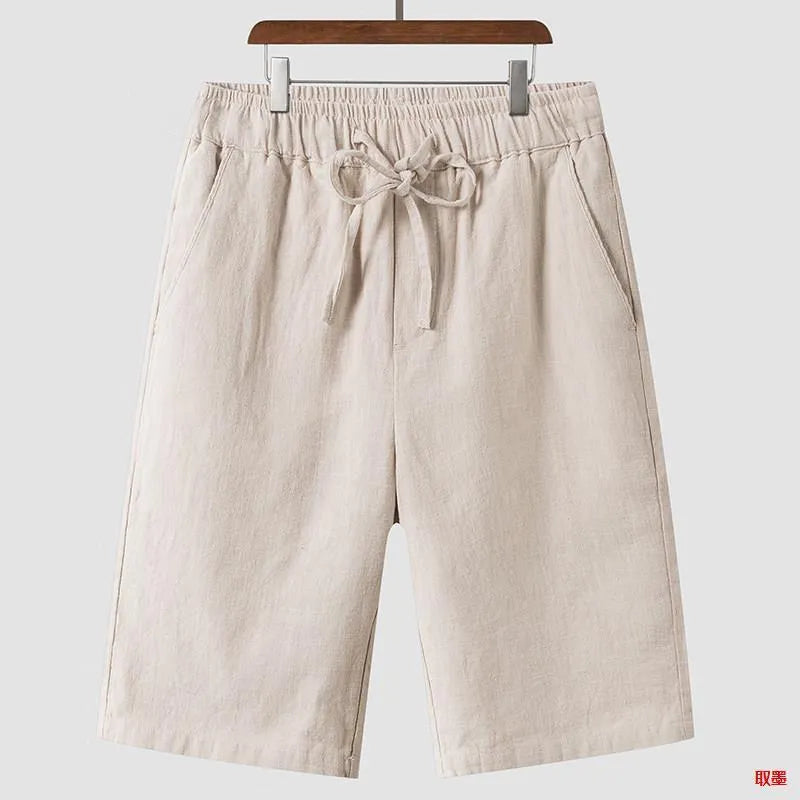 Men's loose linen shorts in beige colour with cropped length and elastic waistband