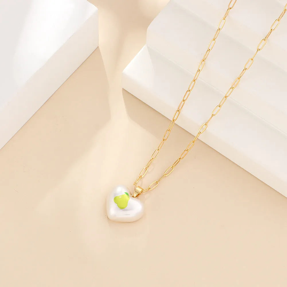 Fresh style geometric necklace with choice of apple, pineapple, strawberry, cherry, and pear fruit pendants on an adjustable chain.