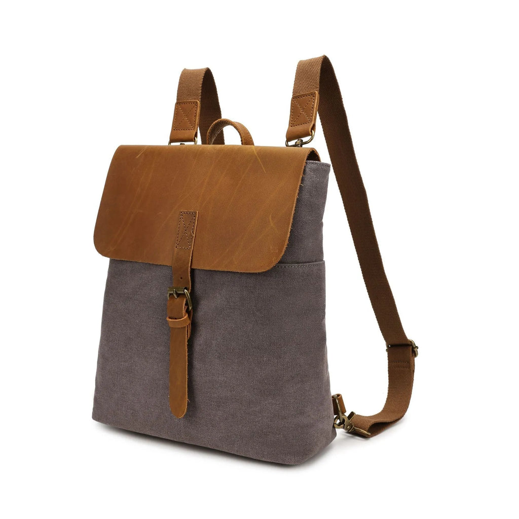 Minimalist Crazy Horse leather and canvas student backpack in neutral colours showing compact dimensions