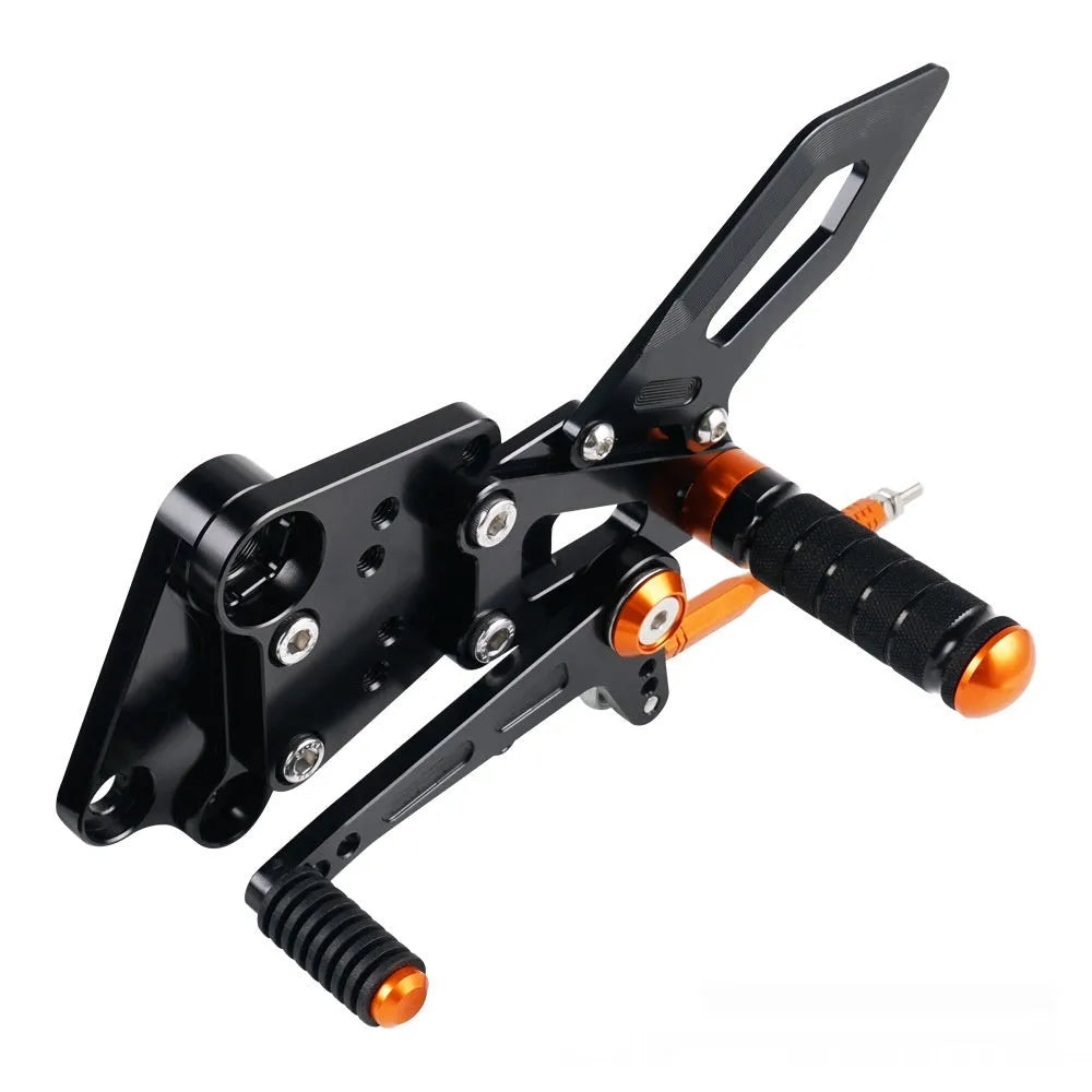 KTM Duke motorcycle rear shift pedal support assembly kit in black and orange.