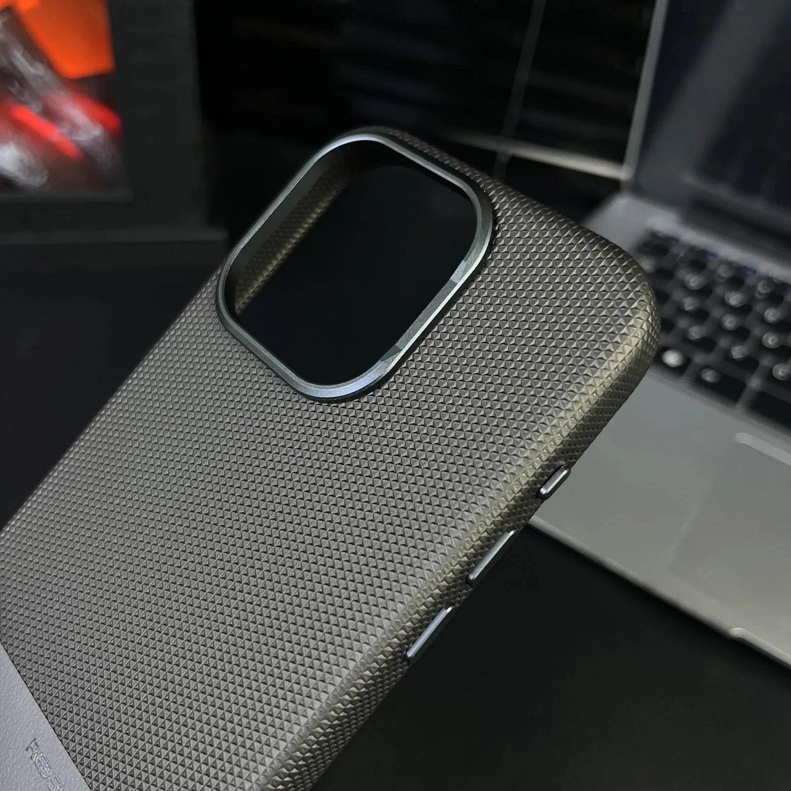 iPhone magnetic phone case with dragon scale texture and stitching detail in black, grey and green colours