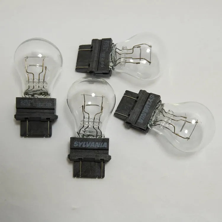 Wagner automotive brake light bulb with yellow glass and 16mm metal socket