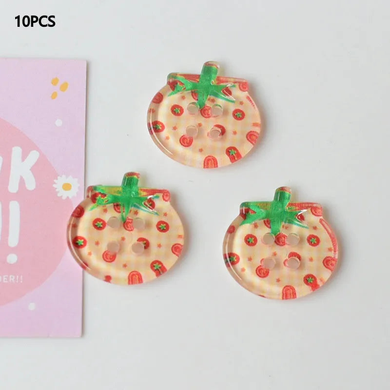 Medium size red tomato pattern button ornaments made from plastic resin, shown in different colour variations.