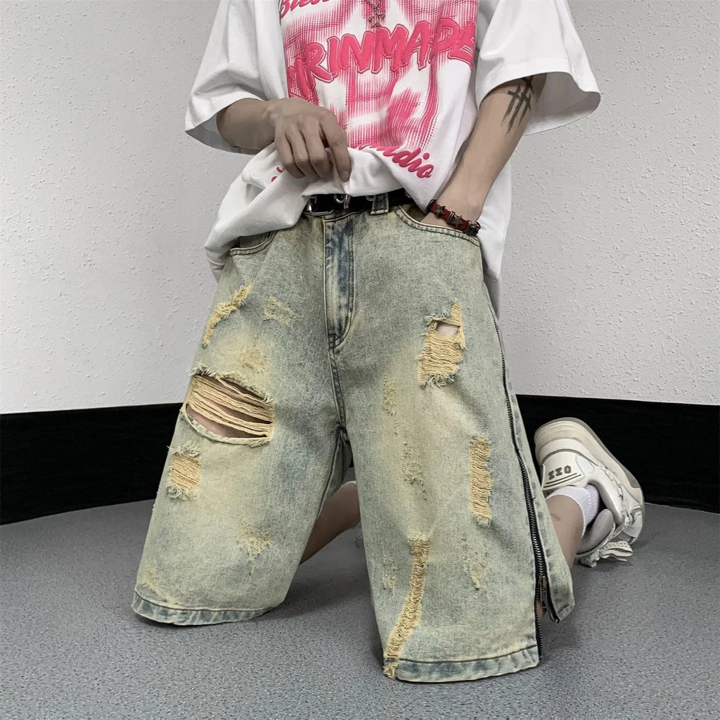 Retro blue men's ripped denim shorts with a loose fit and straight leg opening on a cardigan.