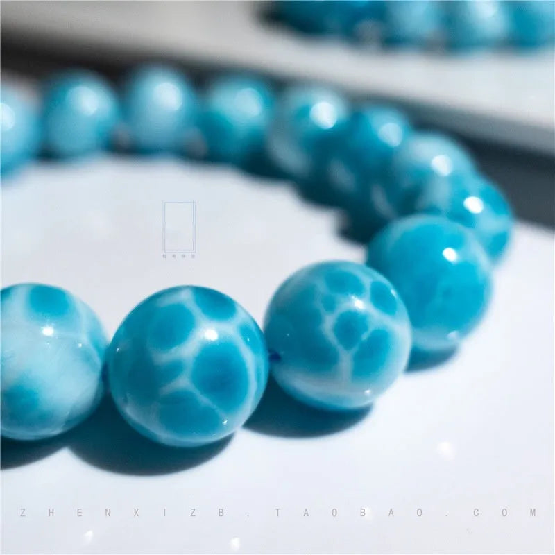Blue Bodhi bead bracelet with manual processing and pearl accents in Maillard style, showing bead sizing options