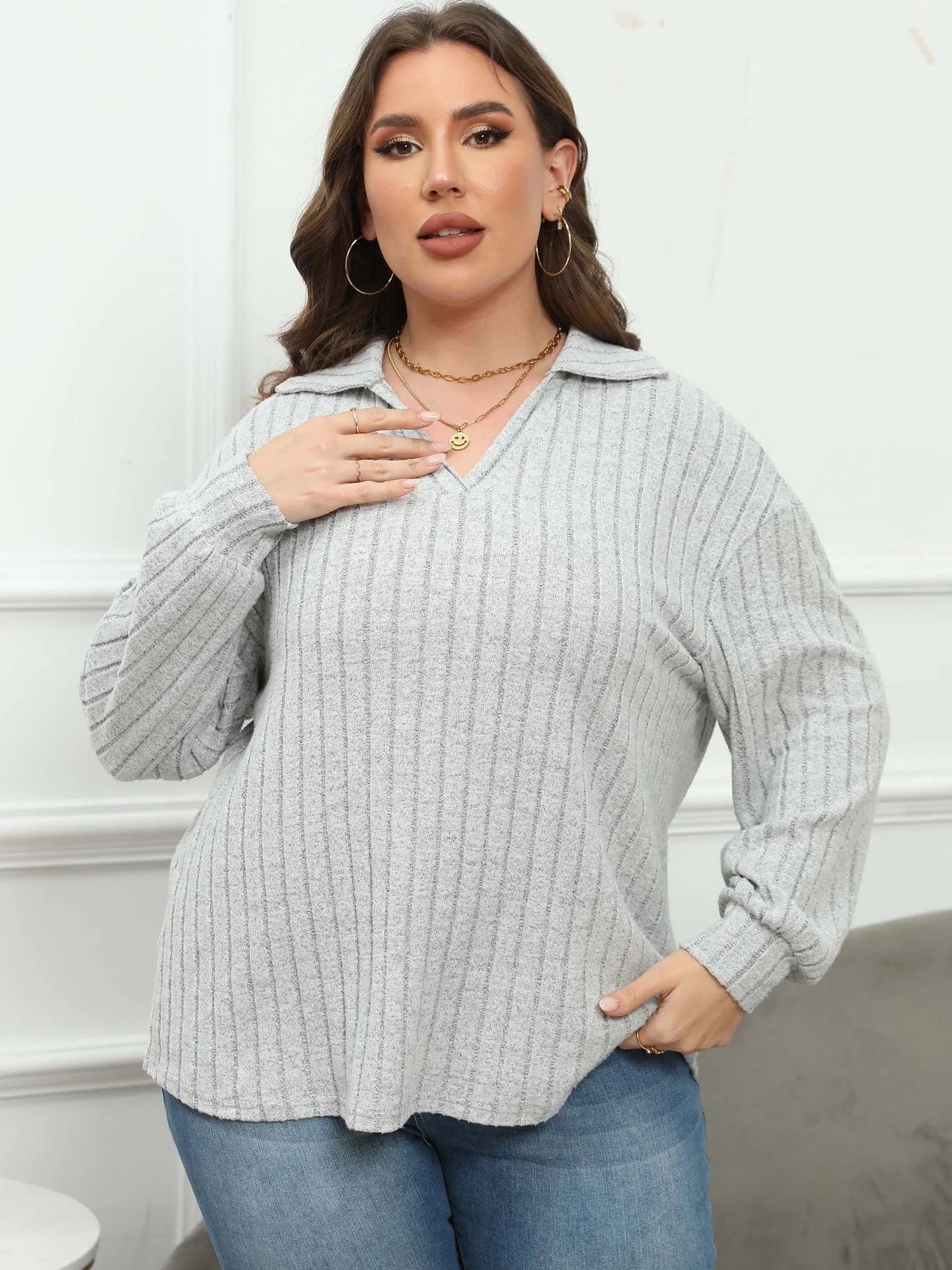 Women's plus size gray polo collar shirt with lantern sleeves and collage stitching details on polar fleece fabric