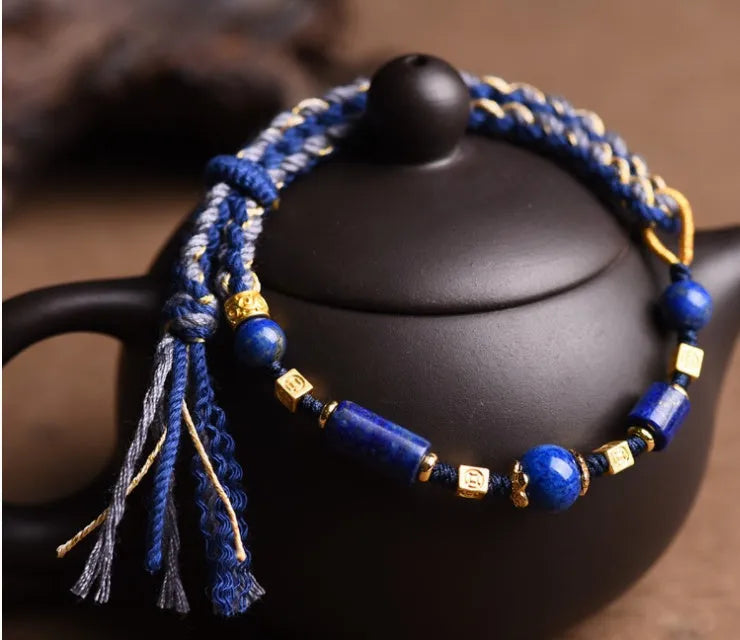 Hand-woven DIY watch band bracelet made from flexible wire in an ethnic lapis lazuli style.