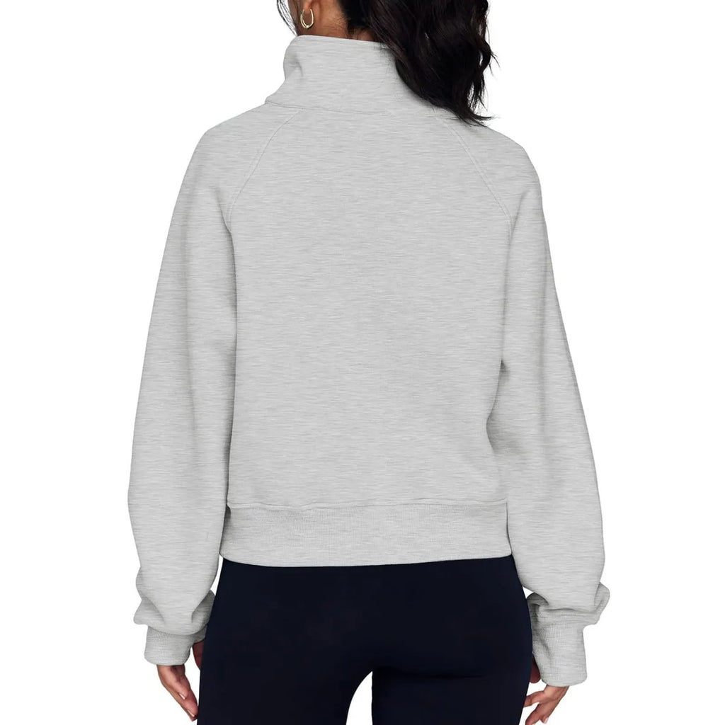 Women's loose fit lapel sweater with fleece lining and long raglan sleeves in a solid colour.
