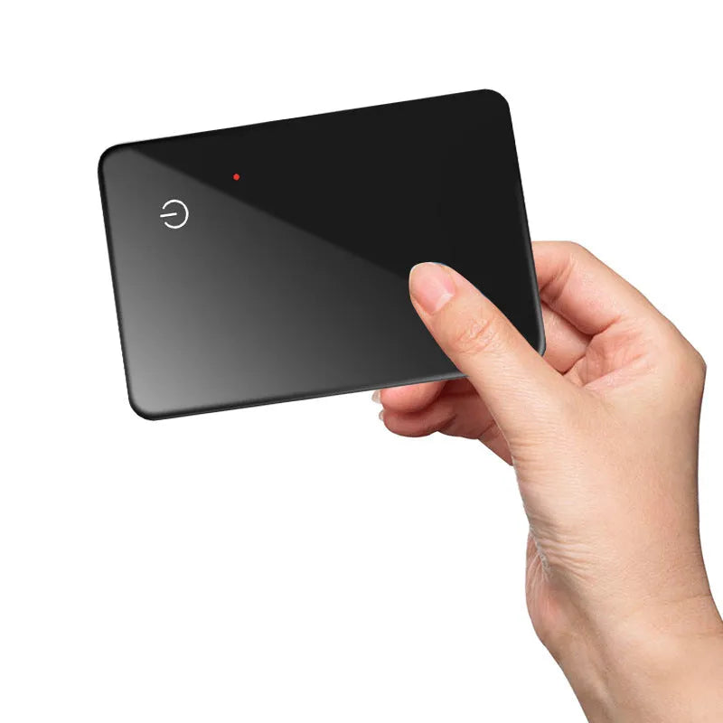 Black credit card sized pet tracker with a hanging hole, showing wireless charging and NFC symbols.