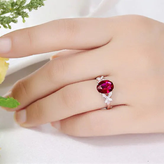 Women's 18k rose gold plated copper butterfly ring in a heart shape, shown in red and blue colour options.