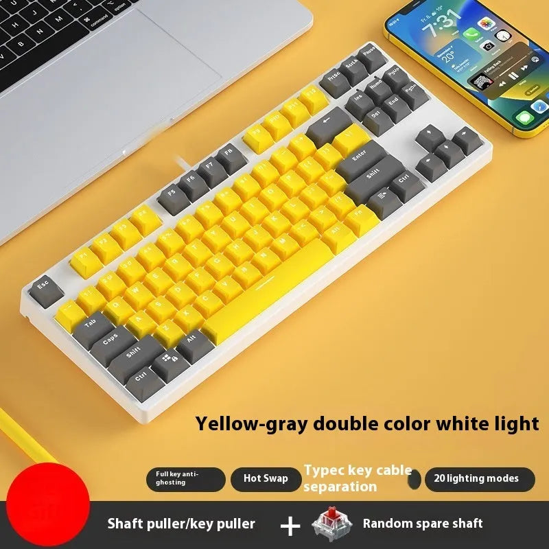 87-key wired mechanical keyboard with two-tone keycaps and metal frame, showing compact design and included tools