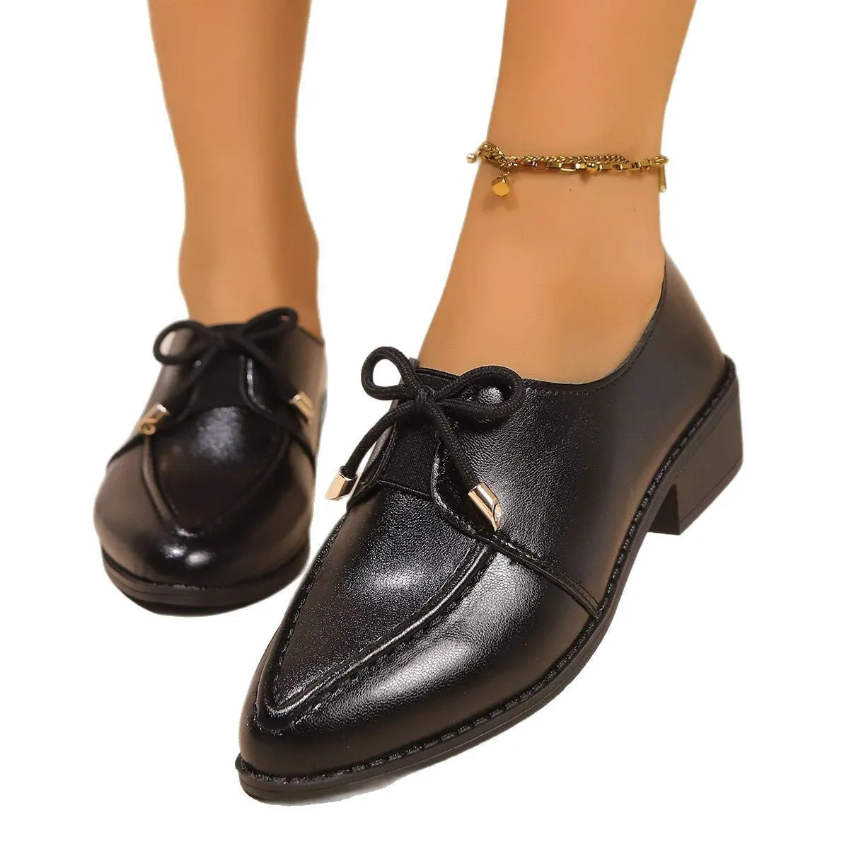 Women's British-style simple leather shoes with bow detailing, PU upper, and rubber sole in available sizes.