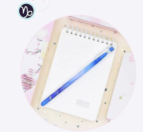Box containing 12 constellation-themed plastic gel pens with quick-drying ink
