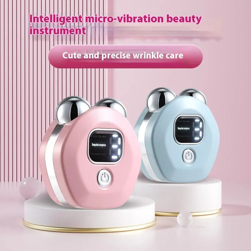 White portable hot compress charging massage instrument with micro current double-rollers for facial skincare