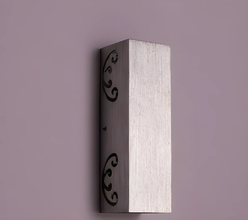 Aluminium butterfly-shaped LED wall lamp in blue, mounted on a white wall.