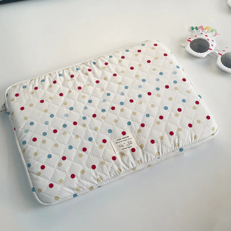 Women's polka dot polyester laptop bag shown in three sizes for 11-inch, 13-inch, and 15-inch laptops.