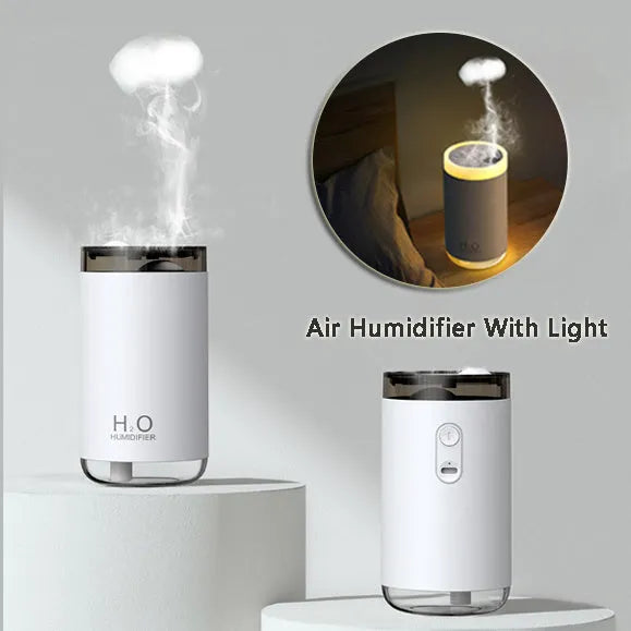 White jellyfish humidifier with blue lighting on wooden table showing mist emission