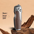 Zinc alloy metal folding lighter with integrated knife in black-brown wood grain finish, showing closed and open positions